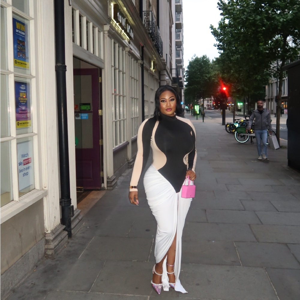 Chic Black and White Dress with Pink Clutch